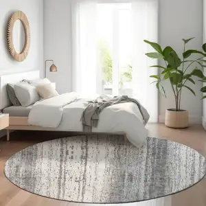 Photo of 8' Gray And Ivory Round Striped Washable Indoor Outdoor Area Rug