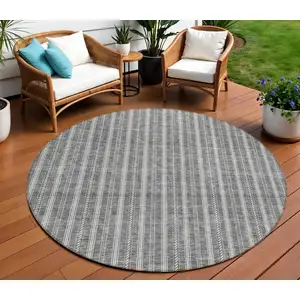 Photo of 8' Gray And Ivory Round Striped Washable Indoor Outdoor Area Rug