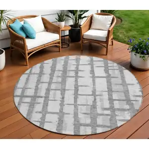 Photo of 8' Gray And Ivory Round Striped Washable Indoor Outdoor Area Rug