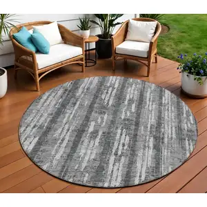 Photo of 8' Gray And Ivory Round Striped Washable Indoor Outdoor Area Rug