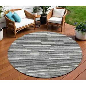 Photo of 8' Gray And Ivory Round Striped Washable Indoor Outdoor Area Rug
