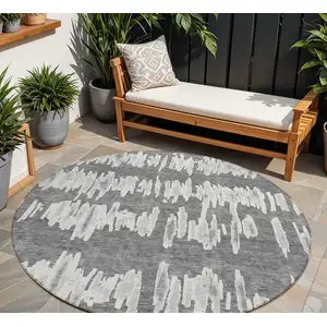 Photo of 8' Gray And Ivory Round Striped Washable Indoor Outdoor Area Rug