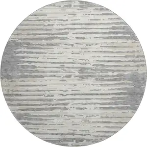 Photo of 8' Gray And Ivory Striped Washable Round Rug With UV Protection