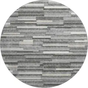 Photo of 8' Gray And Ivory Striped Washable Round Rug With UV Protection