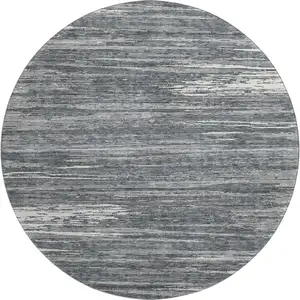 Photo of 8' Gray And Ivory Striped Washable Round Rug With UV Protection