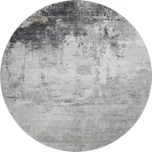 Photo of 8' Gray And Silver Abstract Washable Round Rug With UV Protection