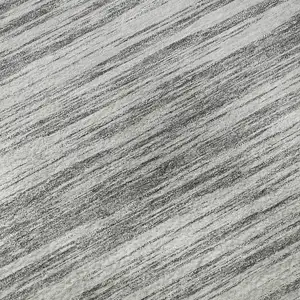 Photo of 8' Gray And Silver Striped Washable Round Rug With UV Protection