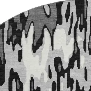 Photo of 8' Gray And Silver Striped Washable Round Rug With UV Protection