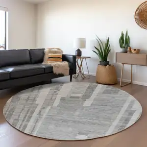 Photo of 8' Gray And Silver Striped Washable Round Rug With UV Protection