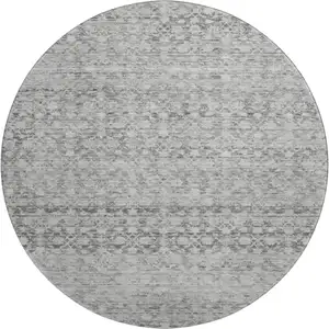 Photo of 8' Gray And Silver Striped Washable Round Rug With UV Protection