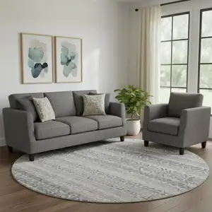 Photo of 8' Gray And Silver Striped Washable Round Rug With UV Protection