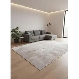 Photo of 8' Gray And White Abstract Washable Round Rug With UV Protection