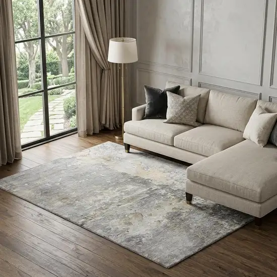 8' Gray Beige And Tan Abstract Washable Area Rug With UV Protection Photo 1