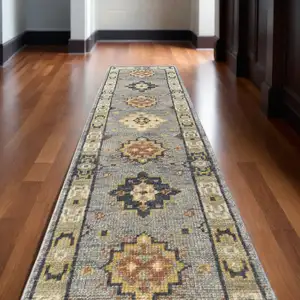 Photo of 12' Gray Blue and Taupe Wool Geometric Hand Knotted Runner Rug With Fringe
