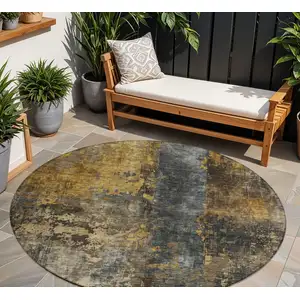 Photo of 8' Gray Brown And Gold Round Abstract Washable Indoor Outdoor Area Rug