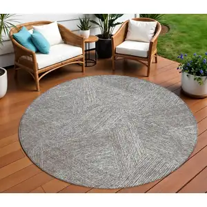 Photo of 8' Gray Brown And Ivory Round Abstract Washable Indoor Outdoor Area Rug