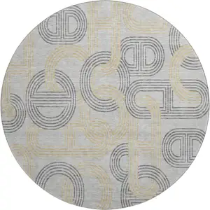 Photo of 8' Gray Charcoal And Gold Geometric Washable Round Rug With UV Protection