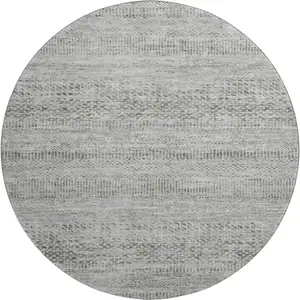 Photo of 8' Gray Charcoal And Silver Striped Washable Round Rug With UV Protection