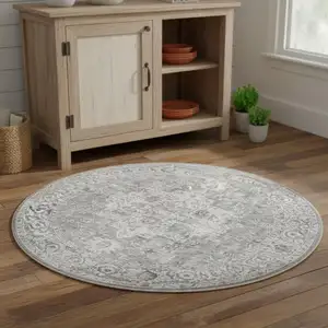 Photo of 4' Gray Floral Power Loom Worn Faded Round Rug