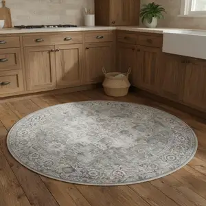 Photo of 5' Gray Floral Power Loom Worn Faded Round Rug