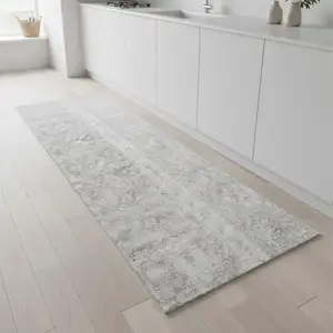 Photo of 8' Gray Floral Power Loom Worn Faded Runner Rug