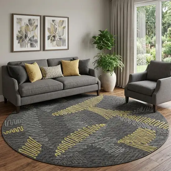 8' Gray Gold And Black Botanical Leaves Washable Round Rug With UV Protection Photo 1