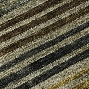 Photo of 8' Gray Gold And Brown Striped Washable Round Rug With UV Protection