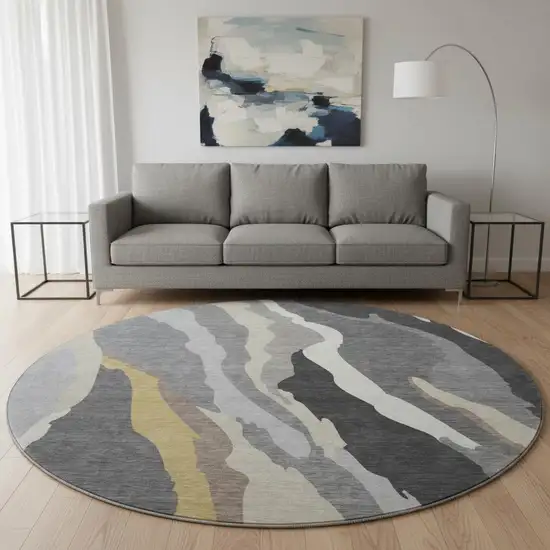 8' Gray Gold And Charcoal Abstract Washable Round Rug With UV Protection Photo 2