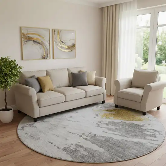 8' Gray Gold And Ivory Abstract Washable Round Rug With UV Protection Photo 1