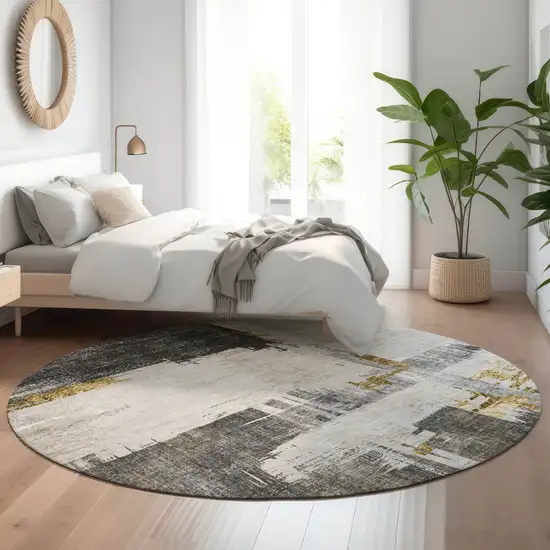 8' Gray Gold And Ivory Abstract Washable Round Rug With UV Protection Photo 4