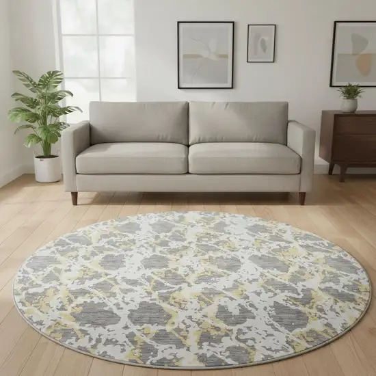 8' Gray Gold And Ivory Abstract Washable Round Rug With UV Protection Photo 2