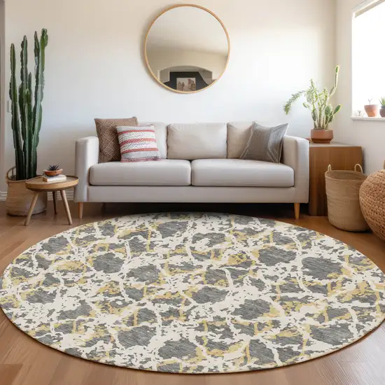 8' Gray Gold And Ivory Abstract Washable Round Rug With UV Protection Photo 4
