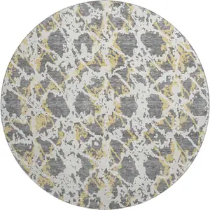 Photo of 8' Gray Gold And Ivory Abstract Washable Round Rug With UV Protection