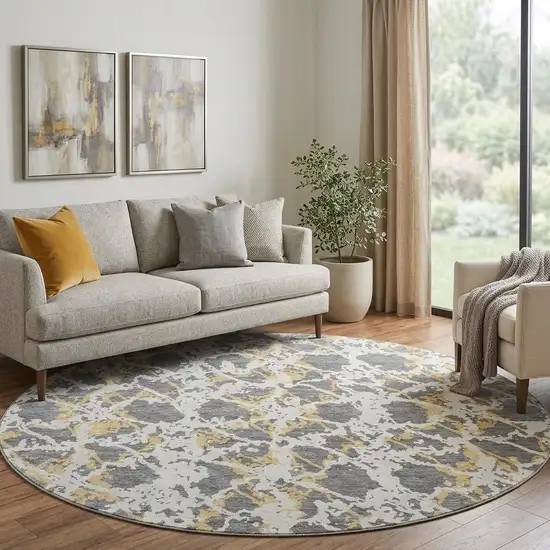 8' Gray Gold And Ivory Abstract Washable Round Rug With UV Protection Photo 1
