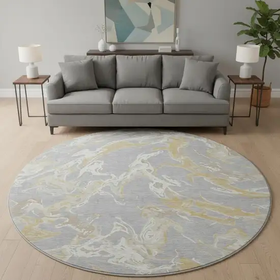 8' Gray Gold And Ivory Abstract Washable Round Rug With UV Protection Photo 2