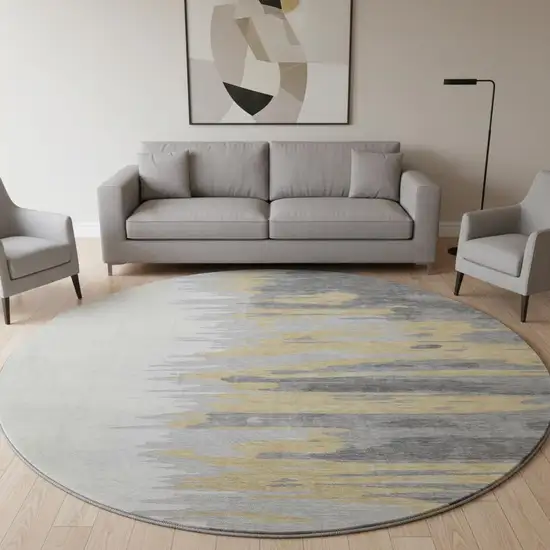 8' Gray Gold And Ivory Abstract Washable Round Rug With UV Protection Photo 2