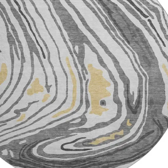 8' Gray Gold And Ivory Abstract Washable Round Rug With UV Protection Photo 2