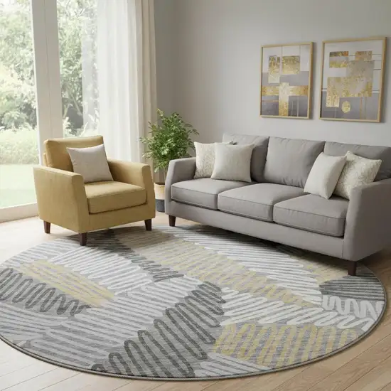 8' Gray Gold And Ivory Floral Washable Round Rug With UV Protection Photo 1