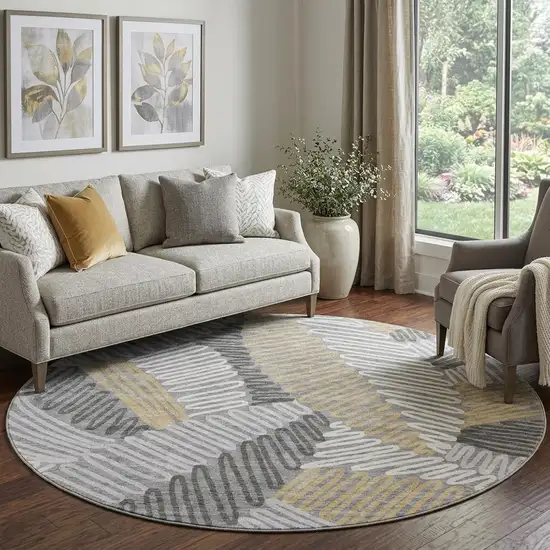 8' Gray Gold And Ivory Floral Washable Round Rug With UV Protection Photo 1