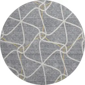 Photo of 8' Gray Gold And Ivory Geometric Washable Round Rug With UV Protection
