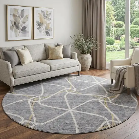 8' Gray Gold And Ivory Geometric Washable Round Rug With UV Protection Photo 1
