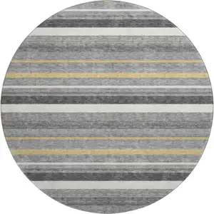 Photo of 8' Gray Gold And Ivory Striped Washable Round Rug With UV Protection