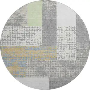 Photo of 8' Gray Gold And Mint Green Geometric Washable Round Rug With UV Protection