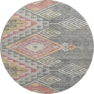 Photo of 8' Gray Gold And Salmon Geometric Washable Round Rug With UV Protection