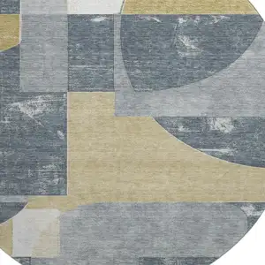 Photo of 8' Gray Gold And Silver Abstract Geometric Washable Round Rug With UV Protection