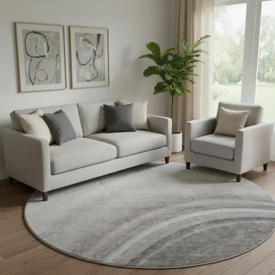 8' Gray Ivory And Beige Ombre Washable Round Rug With UV Protection Photo 1