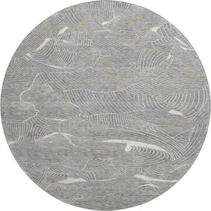 Photo of 8' Gray Ivory And Gold Abstract Washable Round Rug With UV Protection