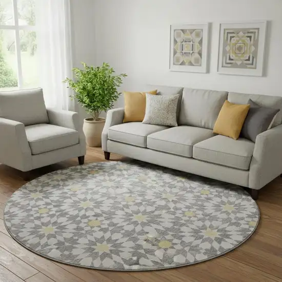 8' Gray Ivory And Gold Geometric Washable Round Rug With UV Protection Photo 1