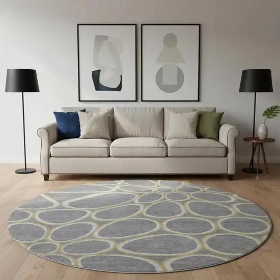 8' Gray Ivory And Gold Geometric Washable Round Rug With UV Protection Photo 2