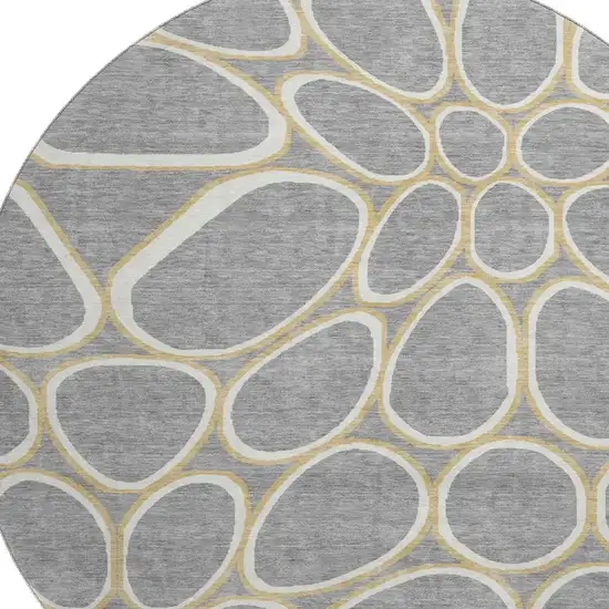 8' Gray Ivory And Gold Geometric Washable Round Rug With UV Protection Photo 2